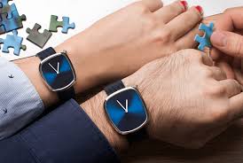 a couple of hands wearing watches