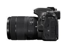 a black camera with a long lens
