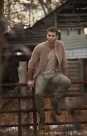 a man sitting on a fence